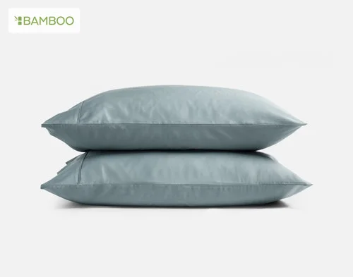 Our Bamboo Cotton Pillowcases in Spruce Green stacked on a white background.