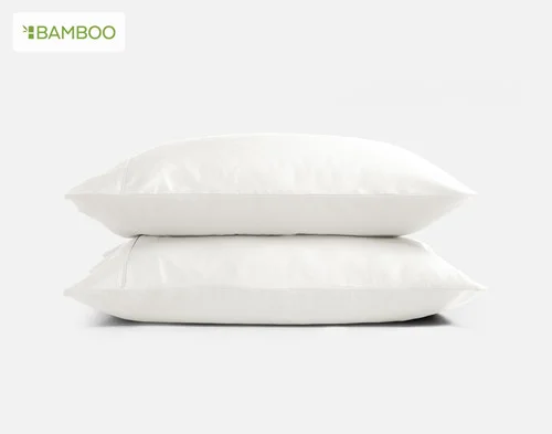Our Bamboo Cotton Pillowcases in White stacked on a white background.