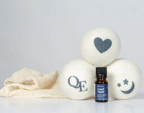 Linen Love Wool Dryer Balls and Good Night scent booster stacked together