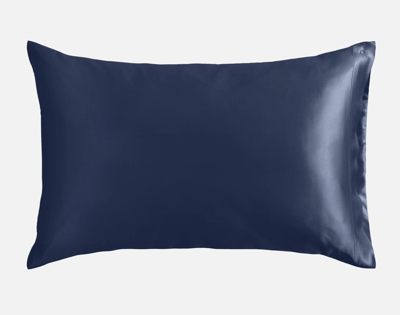 Our Mulberry Silk Pillowcase in Navy sitting against a solid white background.