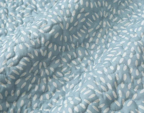 Close-up on the reverse of our Ariel Coverlet Set to show its detailed reverse.