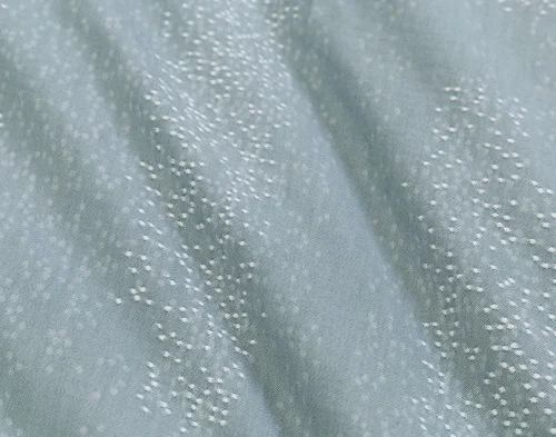 Close-up of the dotted design on the surface of our Aquatico Duvet Cover.