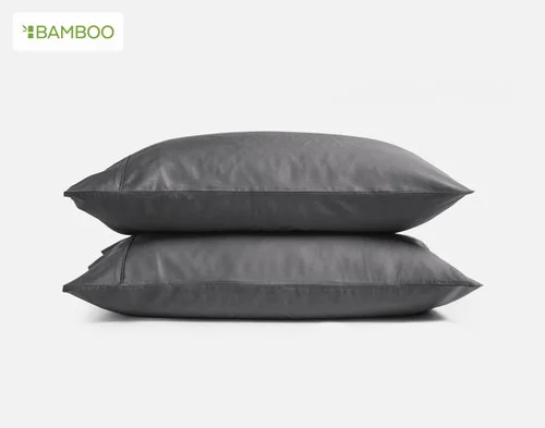 Our Deep Charcoal Bamboo Cotton Pillowcases Stacked on a white background.
