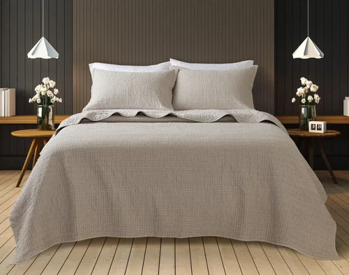 Front view of our Foothills Quilt Set dressed over a queen bed.