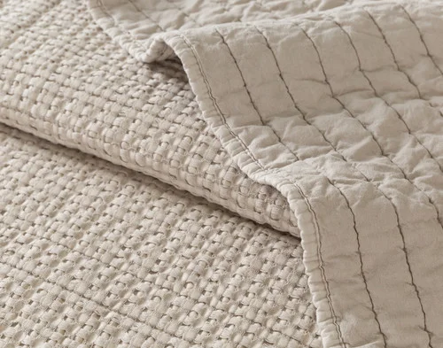 Close-up of the textural waffle surface and stitched stripe backing on our Foothills Quilt Set.