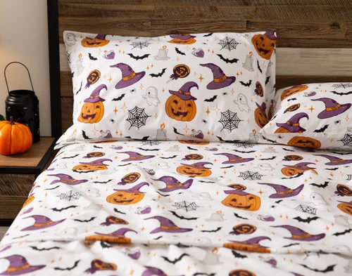 Front view of a pillowcase and the flat sheet of our Hallows Eve Cotton Percale Sheet Set.