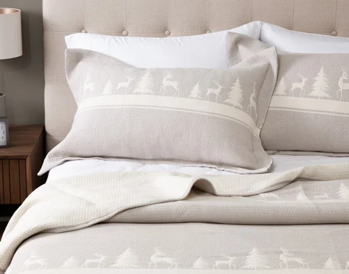 Front, off-centre view of our Deer Trail Cotton Quilt Set dressing a queen bed in a Canadian bedroom.