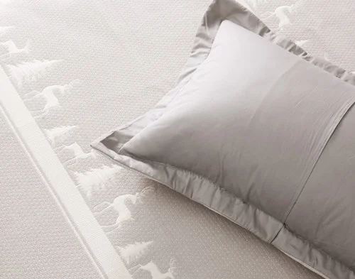 The reverse side of our Deer Trail Pillow Sham atop our Deer Trail Quilt.