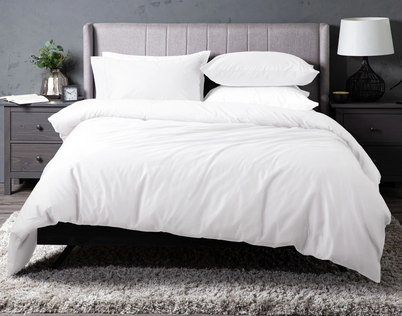 Front view of our White Dream Sateen Duvet Cover Set dressed over a grey bed.