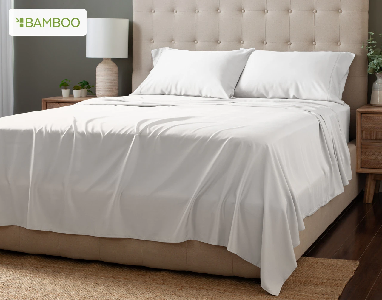Angled view of our White Bamboo Moon Sheet Set dressed over a plain queen bed.