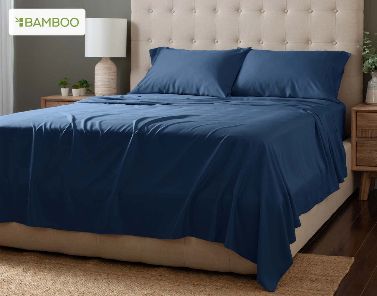 Angled view of our Bluewater Bamboo Moon Sheet Set dressed over a plain queen bed.