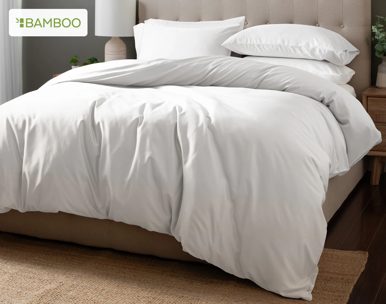 Angled view of our White Bamboo Moon Duvet Cover Set dressed over a plain bed.