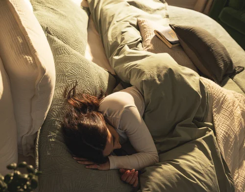 Top-down view of a woman resting in our Matosa collection.