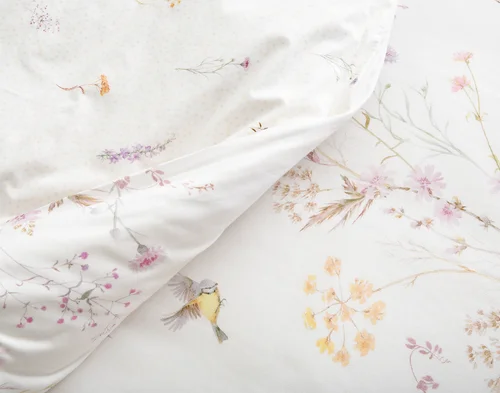 Close up on the folded surface of our Elysium Duvet Cover to show the main and reverse designs.