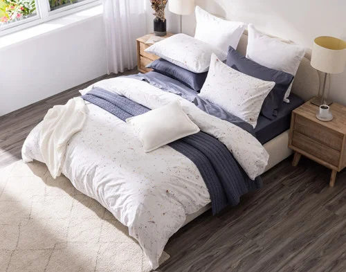 Angled view from above of our Memories Duvet Cover with accessories.