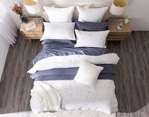 Top-down view of our Memories Duvet Cover with accessories.