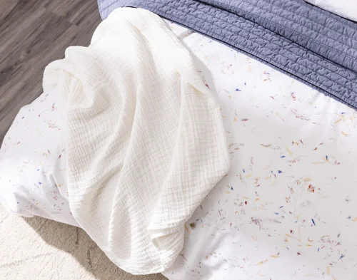 Angled view from above of our Memories Duvet Cover with accessories.