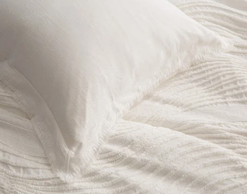 Close view on the corner of our Savary Euro Sham atop our Savary Duvet Cover.
