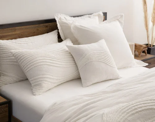 Angled view of our Savary collection dressing the head of a bed.