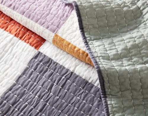 Close up on the folded surface of our Domino Quilt.