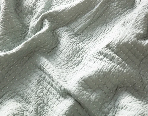 Close up on the solid reverse side of our Domino Quilt.