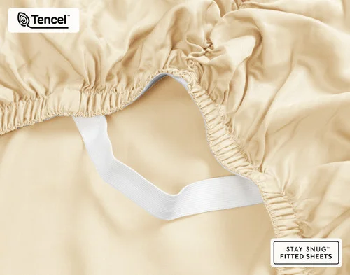 Close-up on the ruffled corner loosely resting on our BeechBliss TENCEL™ Modal Fitted Sheet in Cornsilk.