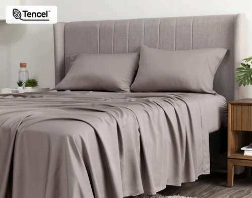 Angled view of a queen bed dressed in our BeechBliss TENCEL™ Modal Sheet Set in Beachcomber.
