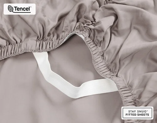 Close-up on the ruffled corner loosely resting on our BeechBliss TENCEL™ Modal Fitted Sheet in Beachcomber.