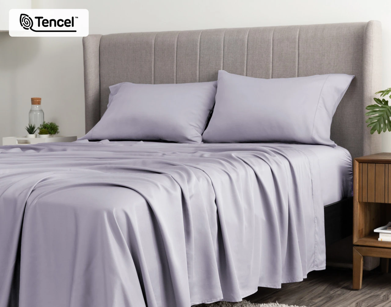 Angled view of a queen bed dressed in our BeechBliss TENCEL™ Modal Sheet Set in Lavender.