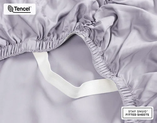 Close-up on the ruffled corner loosely resting on our BeechBliss TENCEL™ Modal Fitted Sheet in Lavender.