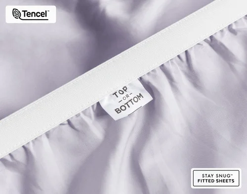 Close-up of Top & Bottom tag on the elastic of our BeechBliss TENCEL™ Modal Fitted Sheet in Lavender.