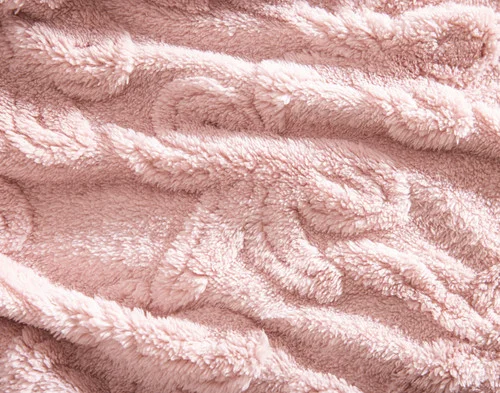 Close up on the surface of our Valentine's Fleece Throw - Etched Bows to show its textured design.