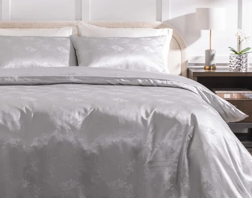 Front view of our Reflections Silk Blend Duvet Cover Set dressed over a plain bed.