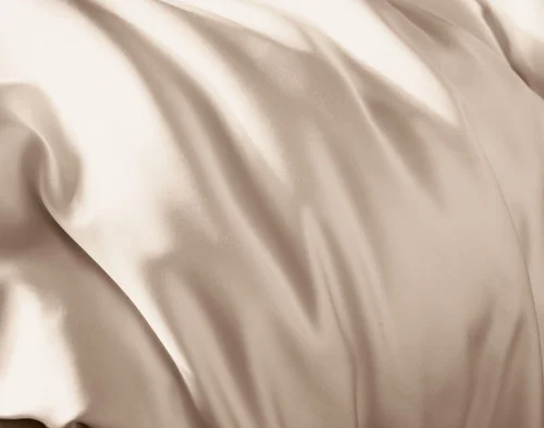 Close-up of the silk blend surface on our Champagne Silk Blend Fitted Sheet.