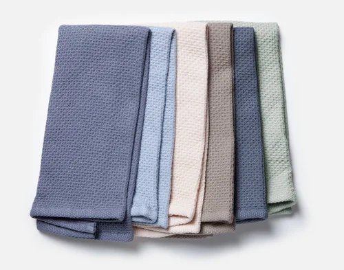Top view of our full Cotton Knit Tea Towel collection fanned across each other.