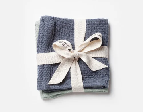 Our Ocean Teal Cotton Knit Dishcloths folded and wrapped in a white bow.