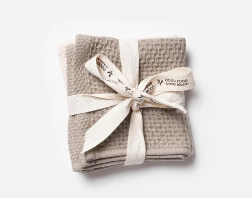 Our Natural Mix Cotton Knit Dishcloths folded and wrapped in a white bow.