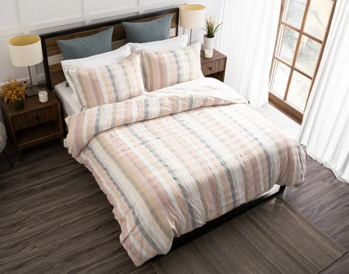 Top-down, angled view of our Carmen collection dressing a queen bed in a simple bedroom.