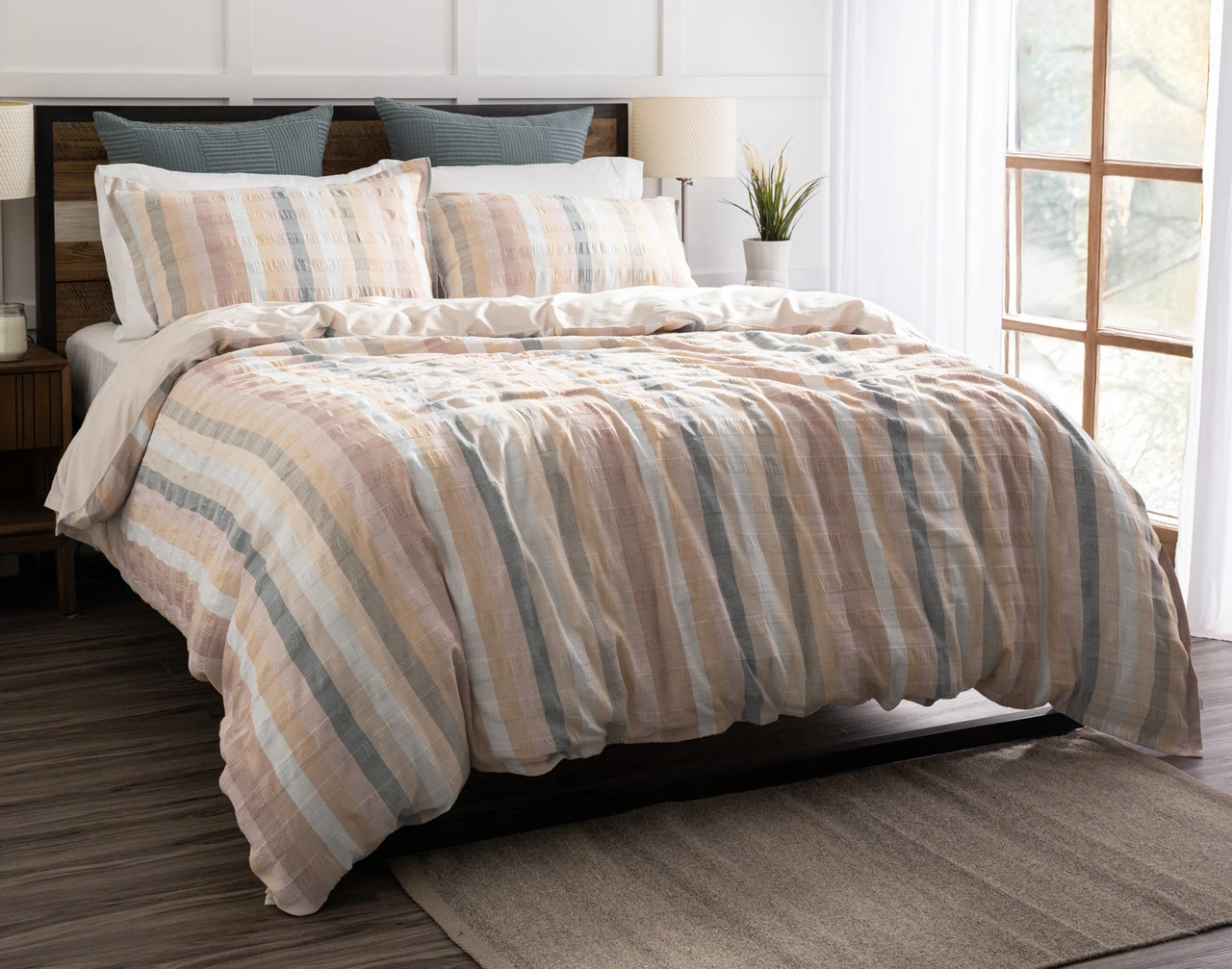 Angled view of our Carmen collection dressing a queen bed in a simple bedroom.