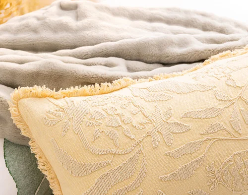 Close view of our Oriana Boudoir Pillow Cover atop its matching duvet cover.