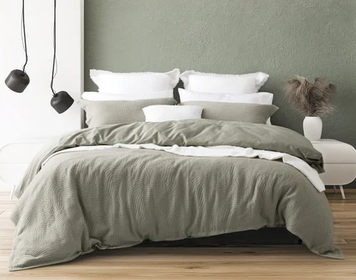 Front view of our Arden Duvet Cover Set dressing a queen bed with white accessories.