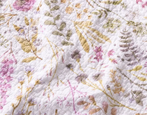 Close-up of the floral pattern on our Zoey Cotton Quilt Set.