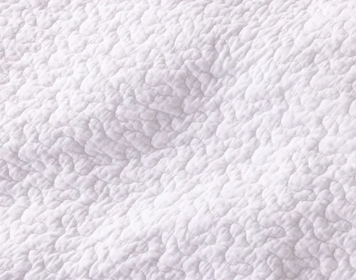 Close-up of the solid white reverse on our Zoey Cotton Quilt Set.