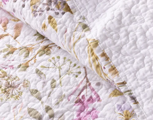 Folded edge on our Zoey Cotton Quilt Set to show its two sides together.