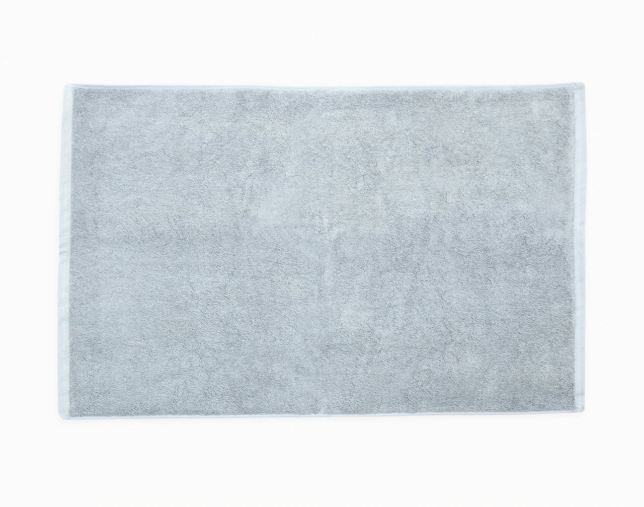 Top view of our Modal Cotton Bath Mat in Blue Dusk sitting against a solid white background.