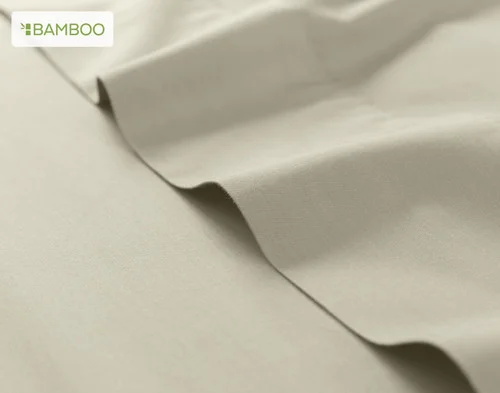 Our Bamboo Cotton Flat Sheet in Thistle atop our Bamboo Cotton Fitted Sheet in Thyme.