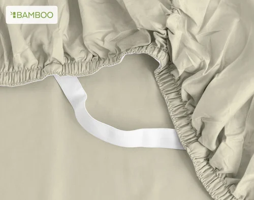 The corner of our Bamboo Cotton Fitted Sheet in Thyme.