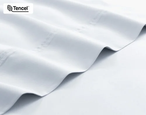 Close-up on the edge of the flat sheet for our Eucalyptus Luxe TENCEL™ Lyocell Sheet Set in Blue Chalk.