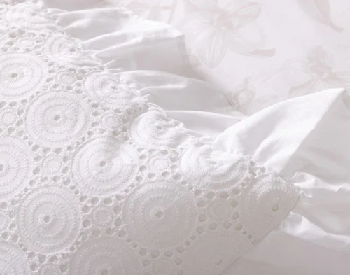 Closer angled view of our Delicata Boudoir Pillow Cover atop the reverse side of our Delicata Duvet Cover.