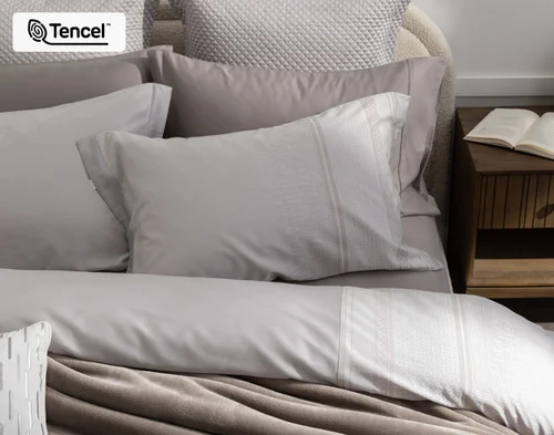 Top-down, off-centre view of our Renley Pillow Shams dressing the head of a bed with our Renley collection.